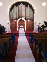 A white bridal runner, ready and waiting inside the historical wedding chapel, Richmond, Indiana