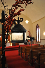 Detail of our Exclusive Pew Lanterns decorated for a Fall Indiana wedding at The historic Olde North Chapel