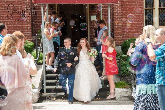 exterior of wedding chapel venue in Richmond, Indiana Dress Blues Bride groom wedding bubbles